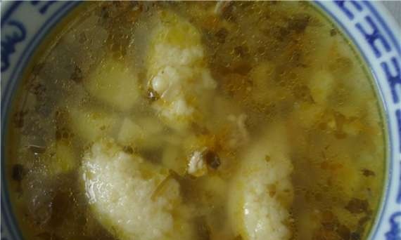 Chicken soup with semolina dumplings and potatoes