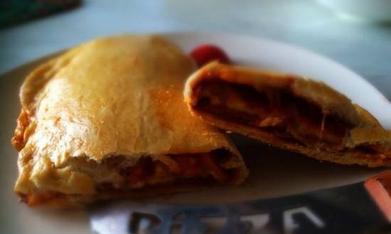 Calzone with sausage, onion and cheese