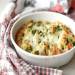 Cauliflower baked with sausages, pesto sauce and mozzarella cheese
