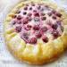 Biscuit with custard and raspberries
