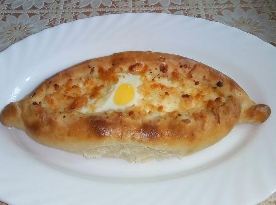 Khachapuri boats with curd and cheese filling