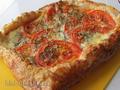 Tart with tomatoes, mozzarella and herbs
