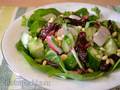 Spinach salad with radishes and dried prunes