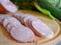 Cooked pork sausage with bacon (wet salted)