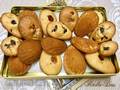 Madeleine cookies with sun-dried berries, chocolate, walnuts and orange zest